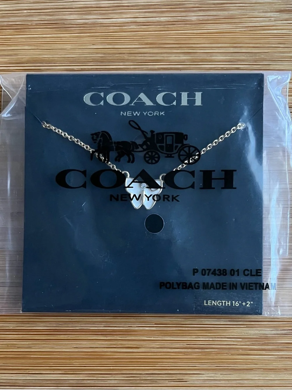 Coach Signature Butterfly Necklace Gold Tone White Enamel w/ a Crystal Accent